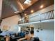 Open-concept living room with a vaulted ceiling and a view of the kitchen at 6336 N Carroll Rd, Indianapolis, IN 46235