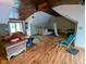 This room features wood floors and a partial stone wall at 6336 N Carroll Rd, Indianapolis, IN 46235