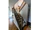 Inviting carpeted staircase with natural wood railing, leading to the upper levels of the residence at 6336 N Carroll Rd, Indianapolis, IN 46235