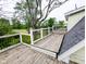 Spacious wooden deck offers great outdoor space with railings and tree views at 6336 N Carroll Rd, Indianapolis, IN 46235