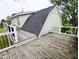 Spacious wooden deck offers great outdoor space with railings and tree view at 6336 N Carroll Rd, Indianapolis, IN 46235
