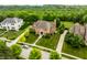 Stunning brick home with lush landscaping, yellow trees, and a beautifully maintained front and back yard at 6639 E Deerfield Dr, Zionsville, IN 46077