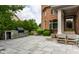 A relaxing backyard patio with an outdoor kitchen and comfortable seating, perfect for enjoying the outdoors at 6639 E Deerfield Dr, Zionsville, IN 46077