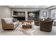 Open basement featuring a bar, sofa, coffee table, and chairs over a hide rug at 6639 E Deerfield Dr, Zionsville, IN 46077