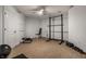 Basement workout area with weight rack, bench, dumbbells, and rubber floor at 6639 E Deerfield Dr, Zionsville, IN 46077