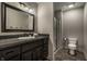 Bathroom featuring a granite vanity and a glass-enclosed shower at 6639 E Deerfield Dr, Zionsville, IN 46077