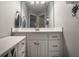 Bright bathroom featuring vanity with white cabinets and a large mirror at 6639 E Deerfield Dr, Zionsville, IN 46077