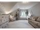 Charming Bedroom with a crib, sofa, and cozy decor, creating a warm atmosphere at 6639 E Deerfield Dr, Zionsville, IN 46077