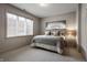 Bedroom featuring a bed with a gray quilt, a window, and gray walls at 6639 E Deerfield Dr, Zionsville, IN 46077