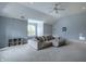 Open bonus room with a sofa, a window bench, and neutral decor at 6639 E Deerfield Dr, Zionsville, IN 46077