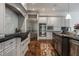 Well-equipped kitchen with stainless steel appliances, a gas range, and white and gray cabinets at 6639 E Deerfield Dr, Zionsville, IN 46077