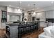 Spacious kitchen with stainless steel appliances, marble backsplash, and a large center island with barstool seating at 6639 E Deerfield Dr, Zionsville, IN 46077