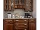 Coffee bar features wooden cabinets, granite countertops and modern coffee appliances at 6639 E Deerfield Dr, Zionsville, IN 46077