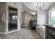 Open main bathroom featuring a walk-in shower and soaking tub underneath a chandelier at 6639 E Deerfield Dr, Zionsville, IN 46077