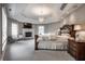 Spacious main bedroom with fireplace, ensuite bath, tray ceiling, and elegant furniture at 6639 E Deerfield Dr, Zionsville, IN 46077