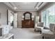 Main bedroom features a sitting area, dresser with mirror, and two large windows at 6639 E Deerfield Dr, Zionsville, IN 46077