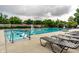 Community swimming pool perfect for summer fun with ample deck space and lounge chairs under a cloudy sky at 6639 E Deerfield Dr, Zionsville, IN 46077