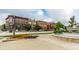 Street view of mixed-use commercial and residential buildings with street fountain in the foreground at 6639 E Deerfield Dr, Zionsville, IN 46077