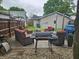 Outdoor patio with grill, fire pit, and comfortable seating in a fenced backyard at , Lebanon, IN 46052