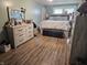 Bright bedroom featuring light walls, hardwood floors and large windows at , Lebanon, IN 46052