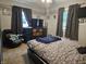 Bedroom with dark furniture, warm tones and a ceiling fan at , Lebanon, IN 46052
