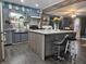 Updated kitchen with gray cabinets, granite countertops, stainless appliances, and an island with bar seating at , Lebanon, IN 46052