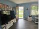Inviting living room with blue walls, dark wood flooring, and a view of the front yard at , Lebanon, IN 46052