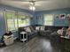 Comfortable living room featuring a large sectional sofa, natural lighting, and blue painted walls at , Lebanon, IN 46052
