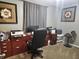 Office with a large wooden desk, comfortable chair and two pieces of art at , Lebanon, IN 46052