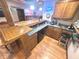 Finished basement bar with a wooden countertop, sink, and ample cabinetry for storing beverages and bar essentials at 7823 Ashtree Dr, Indianapolis, IN 46259