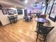 Entertaining basement bar area with tables, chairs, and decor for hosting guests and enjoying casual gatherings at 7823 Ashtree Dr, Indianapolis, IN 46259