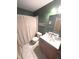 Basement bathroom features wood paneling, a vanity, and a shower at 7823 Ashtree Dr, Indianapolis, IN 46259