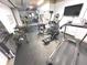 Well-equipped basement gym with various exercise machines and weights for a complete home fitness experience at 7823 Ashtree Dr, Indianapolis, IN 46259