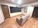 Cozy basement living room featuring a comfortable sofa and a built-in entertainment center with a large screen TV at 7823 Ashtree Dr, Indianapolis, IN 46259