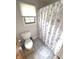 Toilet with window and privacy blind, and decorative shower curtain at 7823 Ashtree Dr, Indianapolis, IN 46259