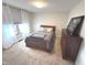 Cozy bedroom featuring a comfortable bed, soft carpet, and plenty of natural light at 7823 Ashtree Dr, Indianapolis, IN 46259