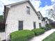 Charming white brick home featuring manicured landscaping, a well-maintained lawn, and a welcoming facade at 7823 Ashtree Dr, Indianapolis, IN 46259