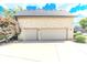 Spacious two-car garage with a large driveway, perfect for parking and storage at 7823 Ashtree Dr, Indianapolis, IN 46259