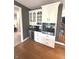 Convenient butler's pantry features a beverage fridge, built-in oven, and ample cabinet space at 7823 Ashtree Dr, Indianapolis, IN 46259