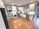 Bright kitchen featuring white cabinets, granite countertops, and stainless steel appliances at 7823 Ashtree Dr, Indianapolis, IN 46259