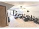 Cozy upstairs living room with comfortable seating, a ceiling fan, and neutral carpet at 7823 Ashtree Dr, Indianapolis, IN 46259
