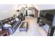 Large upstairs living room with plush seating, entertainment setup, and neutral carpet at 7823 Ashtree Dr, Indianapolis, IN 46259