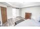 Bright bedroom featuring a barn door to the bathroom and closet space at 7823 Ashtree Dr, Indianapolis, IN 46259