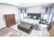 Inviting bedroom with tray ceilings, a plush bed, and stylish decor at 7823 Ashtree Dr, Indianapolis, IN 46259