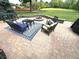 Outdoor living space with comfortable seating around a fire pit, ideal for relaxation and social gatherings at 7823 Ashtree Dr, Indianapolis, IN 46259