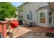 Outdoor deck with barbecue grill, patio table with lake views in backyard at 8376 Glen Highlands Dr, Indianapolis, IN 46236