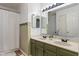 Double vanity bathroom with modern fixtures, warm lighting and shower curtain at 8376 Glen Highlands Dr, Indianapolis, IN 46236