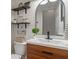 Charming bathroom with modern vanity, decorative mirror, and stylish fixtures at 8376 Glen Highlands Dr, Indianapolis, IN 46236