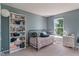 Tranquil bedroom with daybed, stylish decor, and a window view at 8376 Glen Highlands Dr, Indianapolis, IN 46236