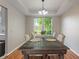 Dining room with a coffered ceiling, hardwood floors, and a view of the backyard at 8376 Glen Highlands Dr, Indianapolis, IN 46236